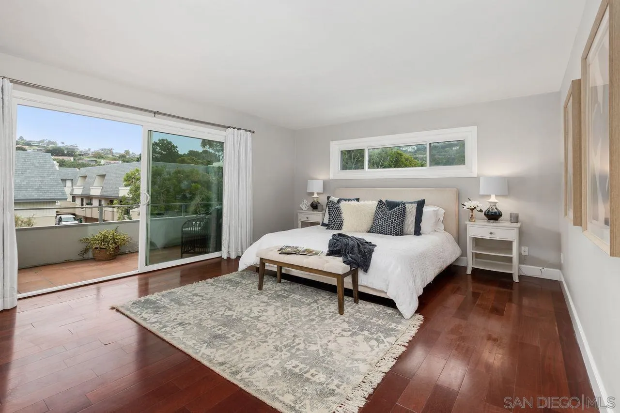 2362 Torrey Pines Road, Unit 33 La Jolla, CA 92037 - Photo 13 of 32 a bedroom with a bed and window