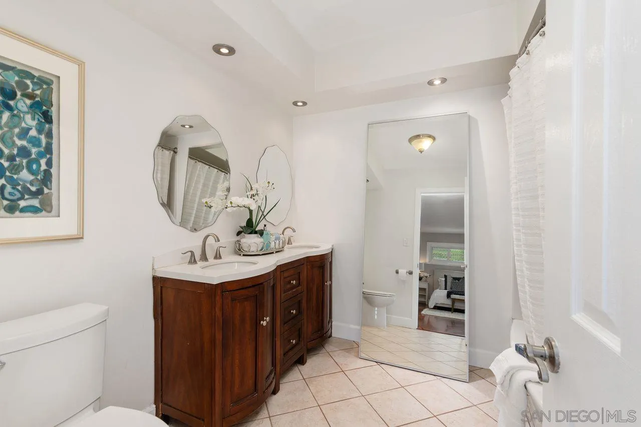 2362 Torrey Pines Road, Unit 33 La Jolla, CA 92037 - Photo 16 of 32 a bathroom with a sink a toilet and shower