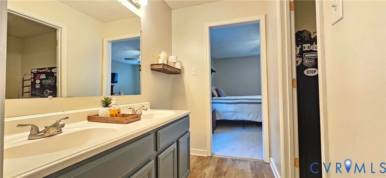 2239 Mantapike Landing Road Stevensville, VA 23161 - Photo 13 of 22 a bathroom with a sink a toilet and shower