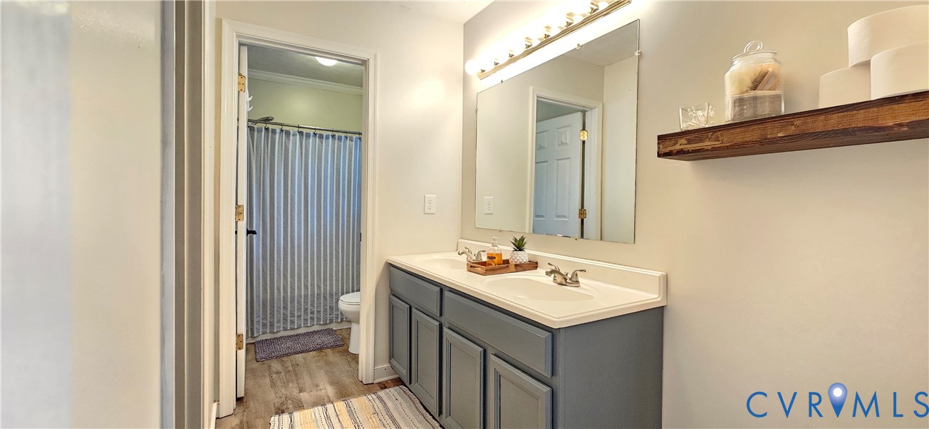 2239 Mantapike Landing Road Stevensville, VA 23161 - Photo 14 of 22 a bathroom with a sink mirror and a vanity