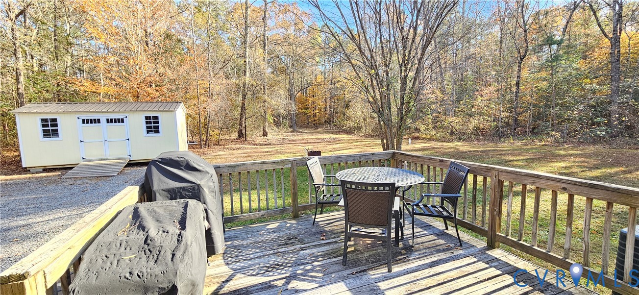 2239 Mantapike Landing Road Stevensville, VA 23161 - Photo 18 of 22 a view of a chairs and table on the balcony
