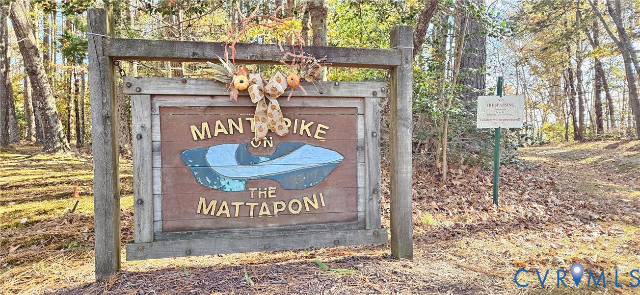 2239 Mantapike Landing Road Stevensville, VA 23161 - Photo 22 of 22 a view of outdoor space with sign board