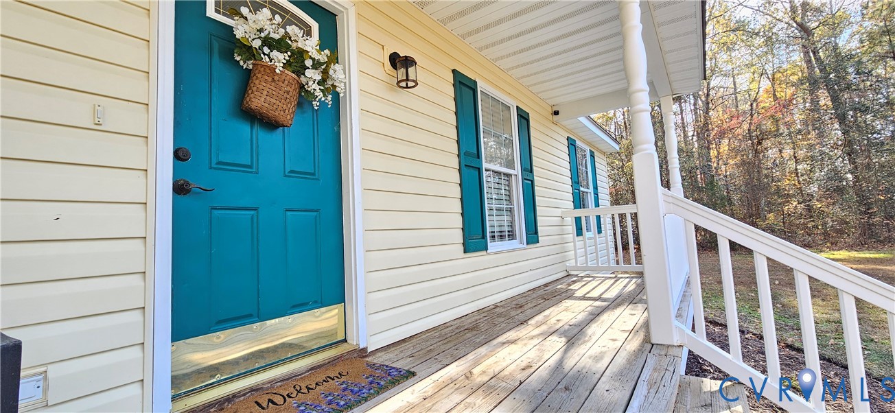 2239 Mantapike Landing Road Stevensville, VA 23161 - Photo 3 of 22 a view of a house with wooden door and deck