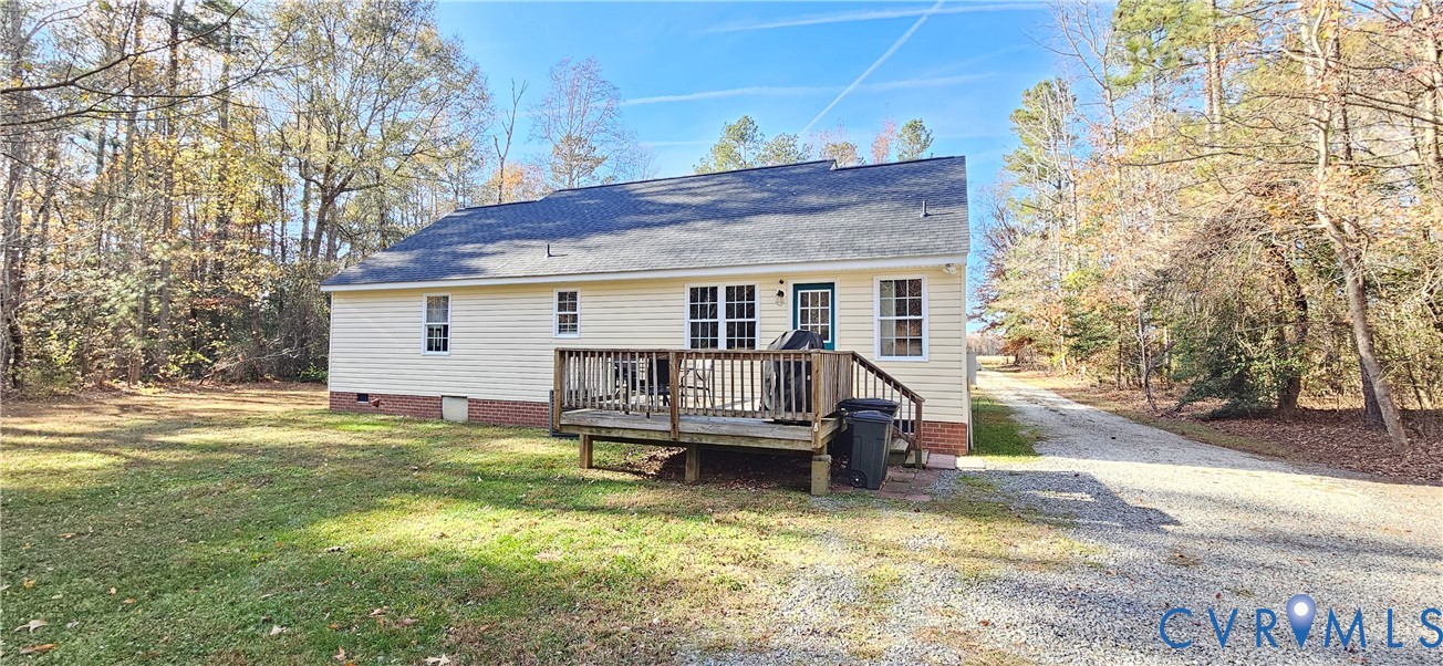 2239 Mantapike Landing Road Stevensville, VA 23161 - Photo 4 of 22 a view of a house with a bed and wooden fence