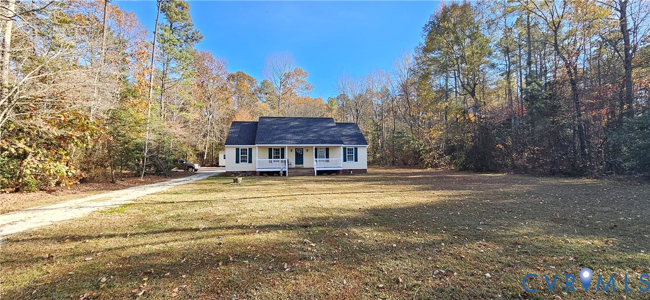 2239 Mantapike Landing Road Stevensville, VA 23161 - Photo 5 of 22 a view of a large house with a big yard and large trees