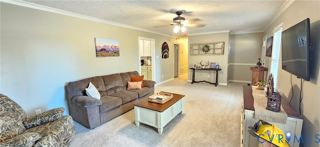 2239 Mantapike Landing Road Stevensville, VA 23161 - Photo 6 of 22 a living room with furniture and a flat screen tv
