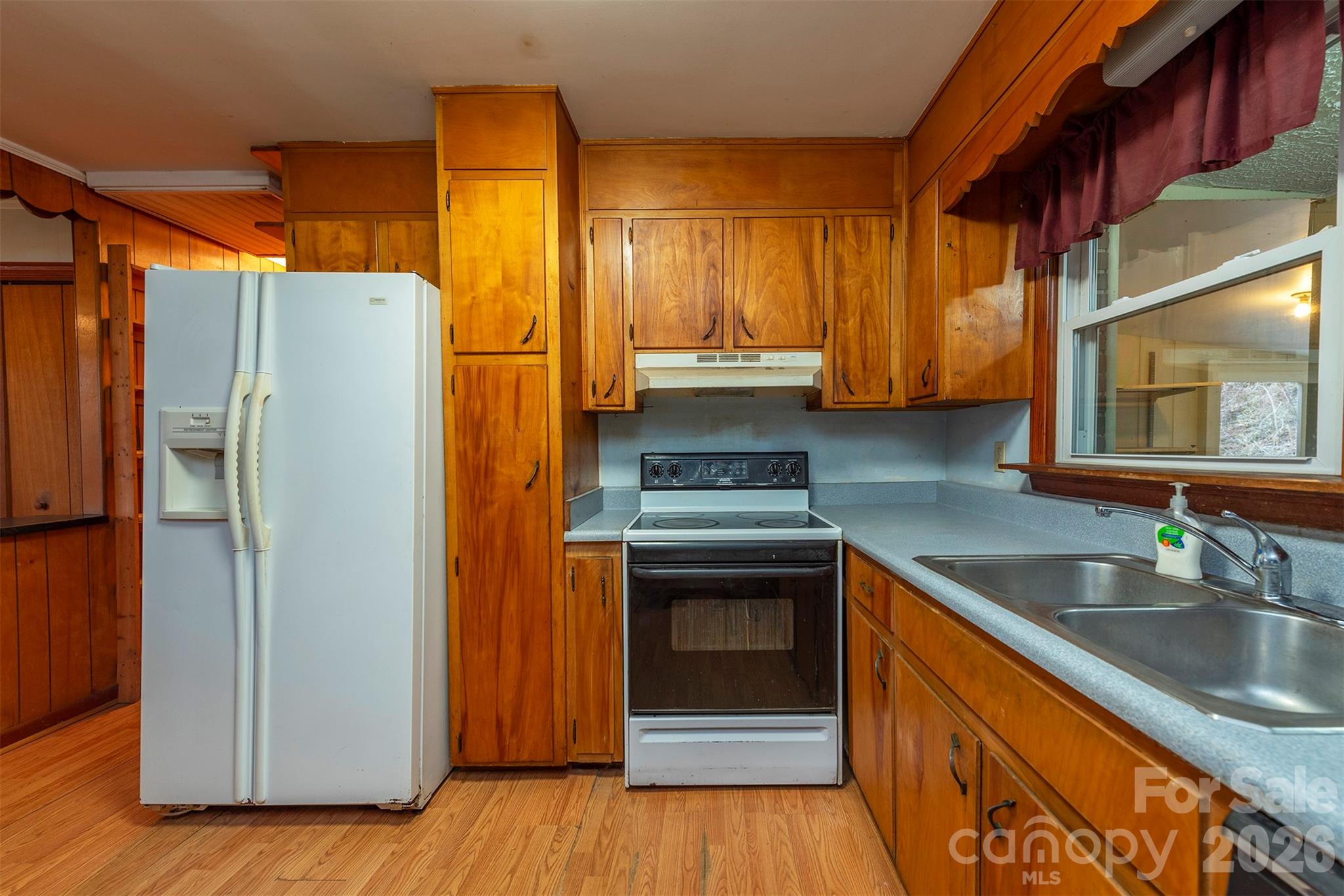 175 River Lane Canton, NC 28716 - Photo 11 of 35 a kitchen with stainless steel appliances granite countertop a refrigerator a sink and a stove