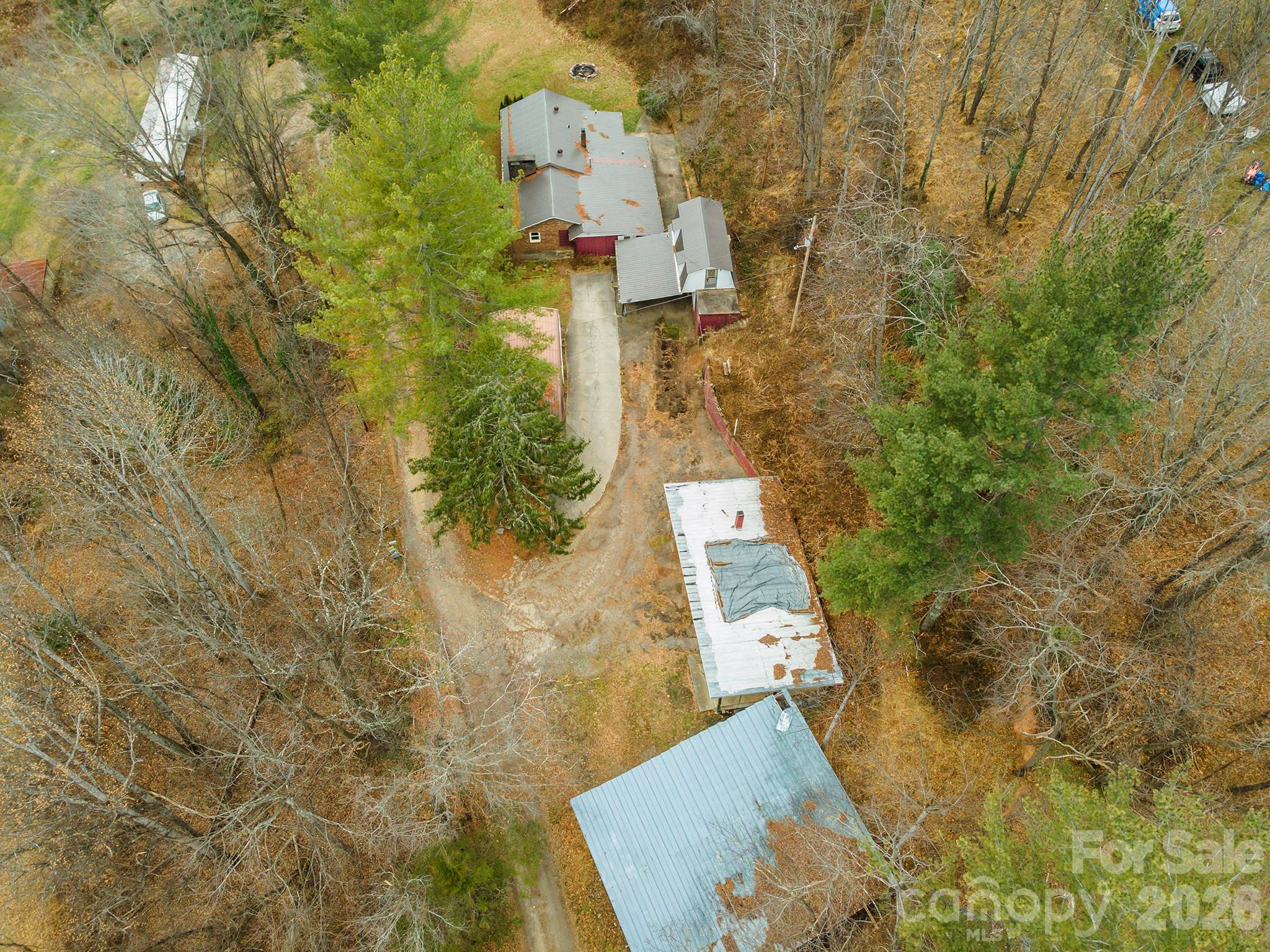 175 River Lane Canton, NC 28716 - Photo 25 of 35 aerial view of a house with a yard