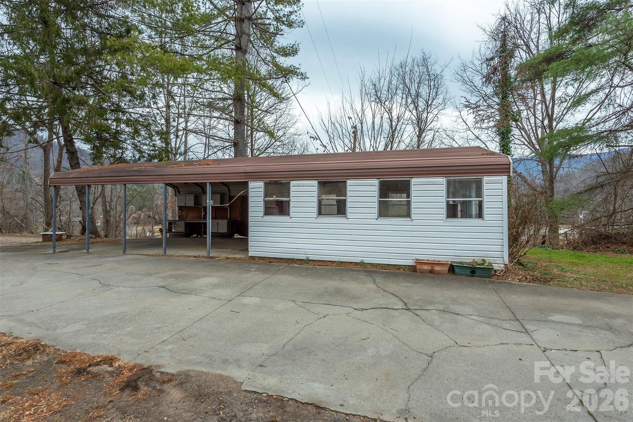 175 River Lane Canton, NC 28716 - Photo 30 of 35 a view of a house with a yard