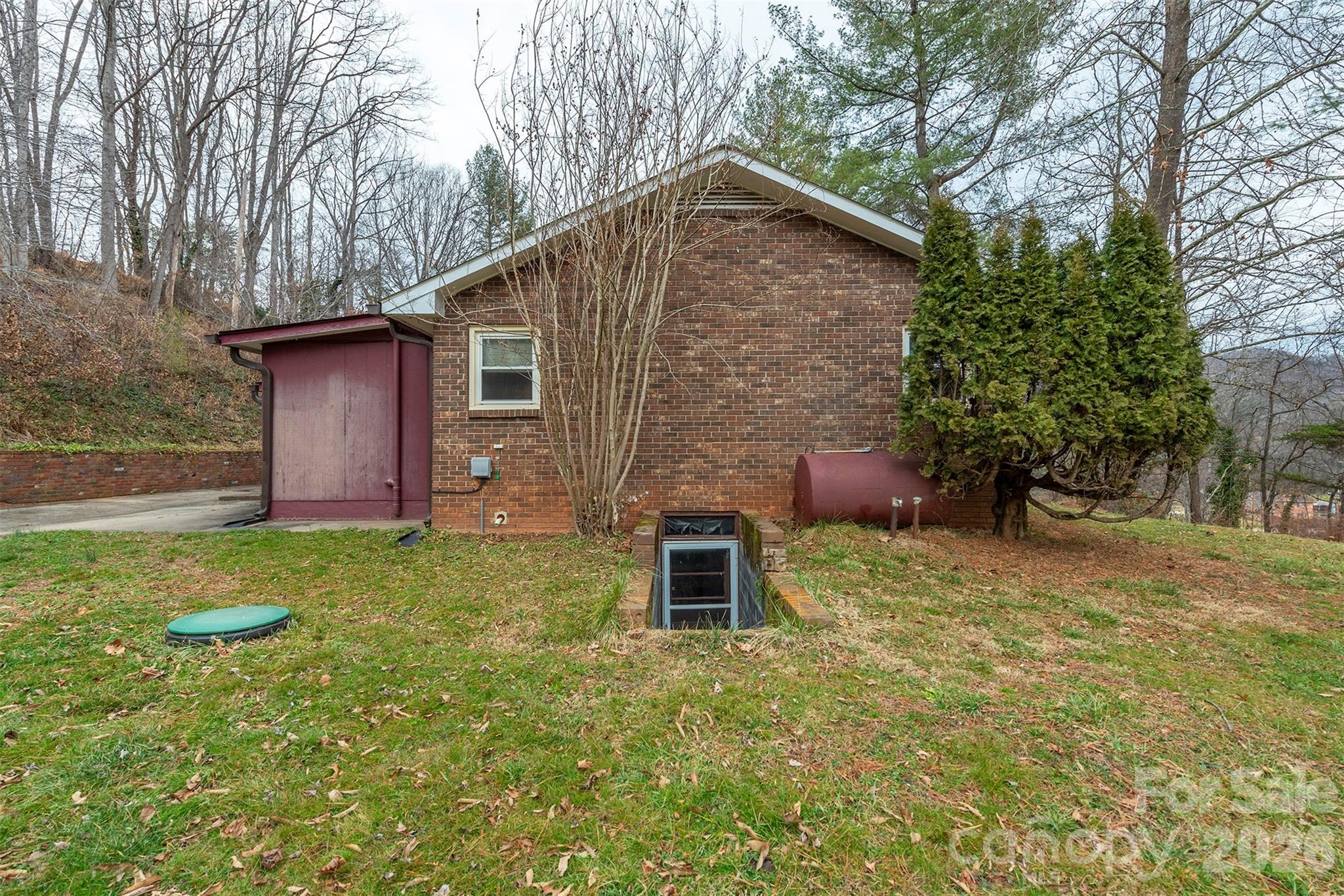 175 River Lane Canton, NC 28716 - Photo 4 of 35 a backyard of a house with lots of green space