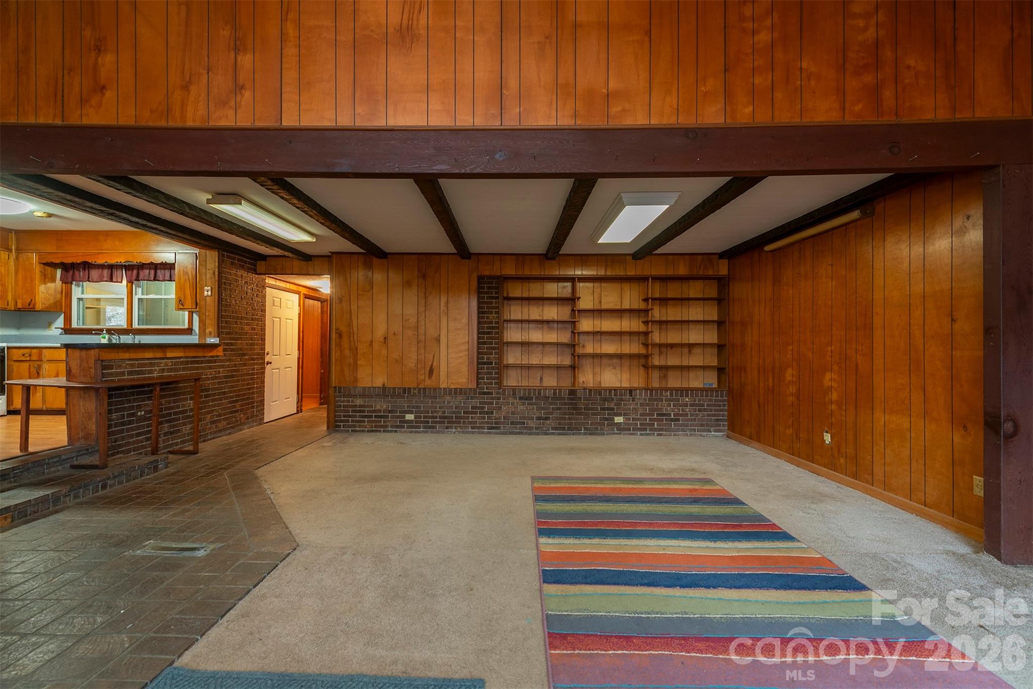 175 River Lane Canton, NC 28716 - Photo 6 of 35 a area with wooden floor and windows