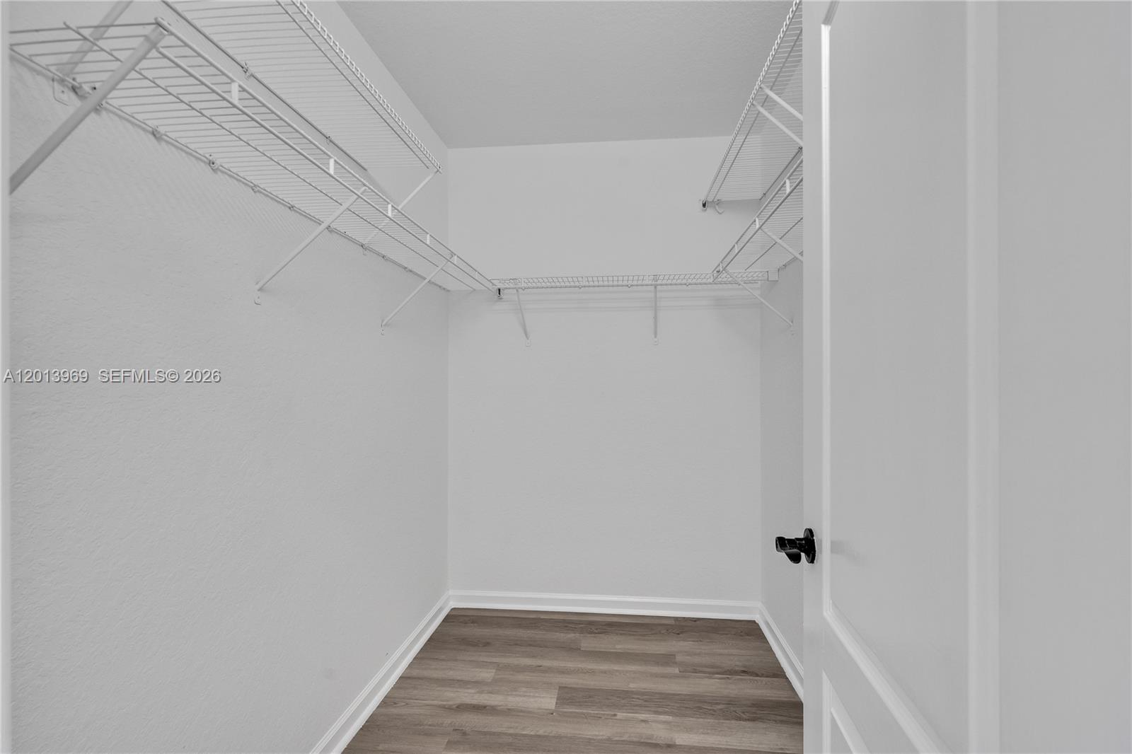 14044 Southwest 273rd Lane, Unit 14044 Homestead, FL 33032 - Photo 20 of 44 a view of a room with wooden floor
