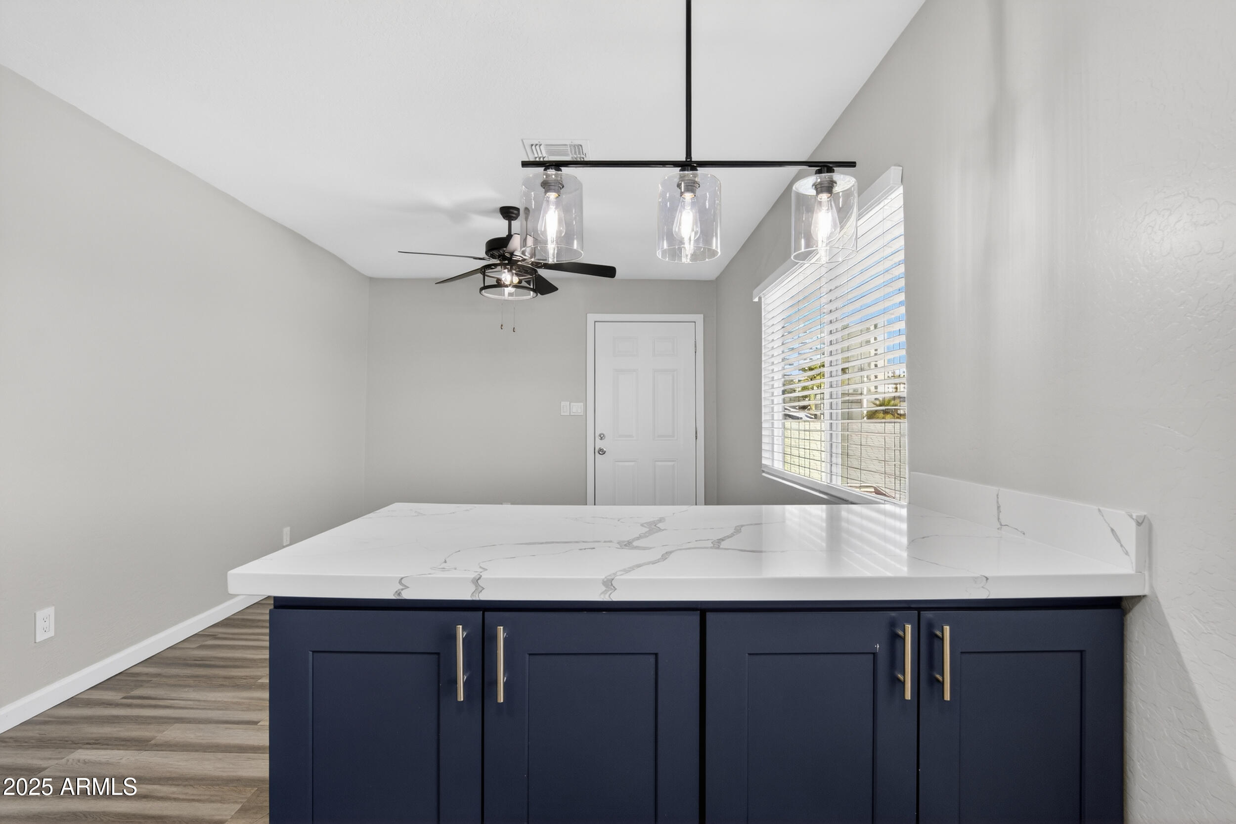 1110 North 10th Street, Unit 2 Phoenix, AZ 85006 - Photo 11 of 22 a view of kitchen island with wooden floor