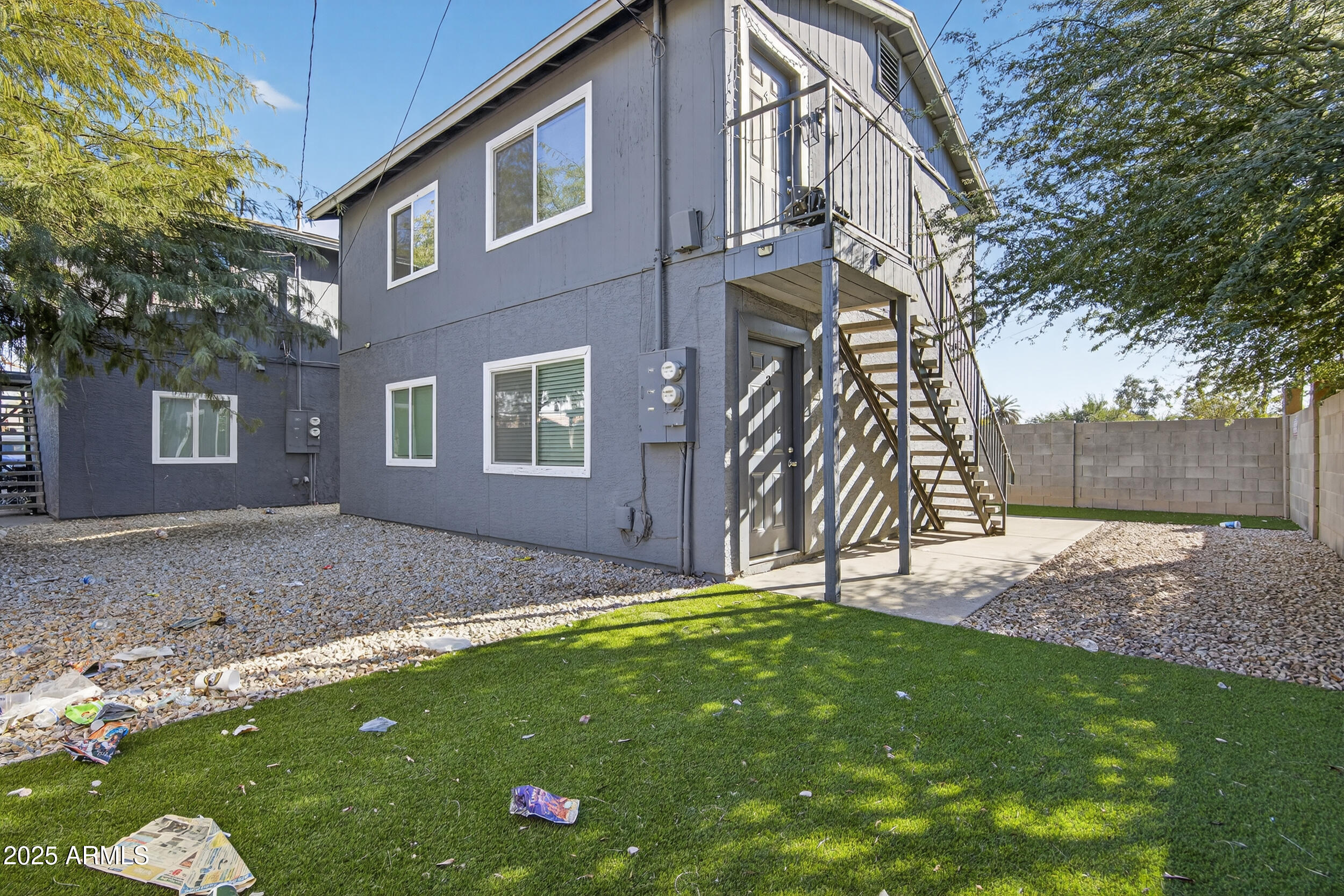 1110 North 10th Street, Unit 2 Phoenix, AZ 85006 - Photo 2 of 22 a backyard of a house with lots of green space