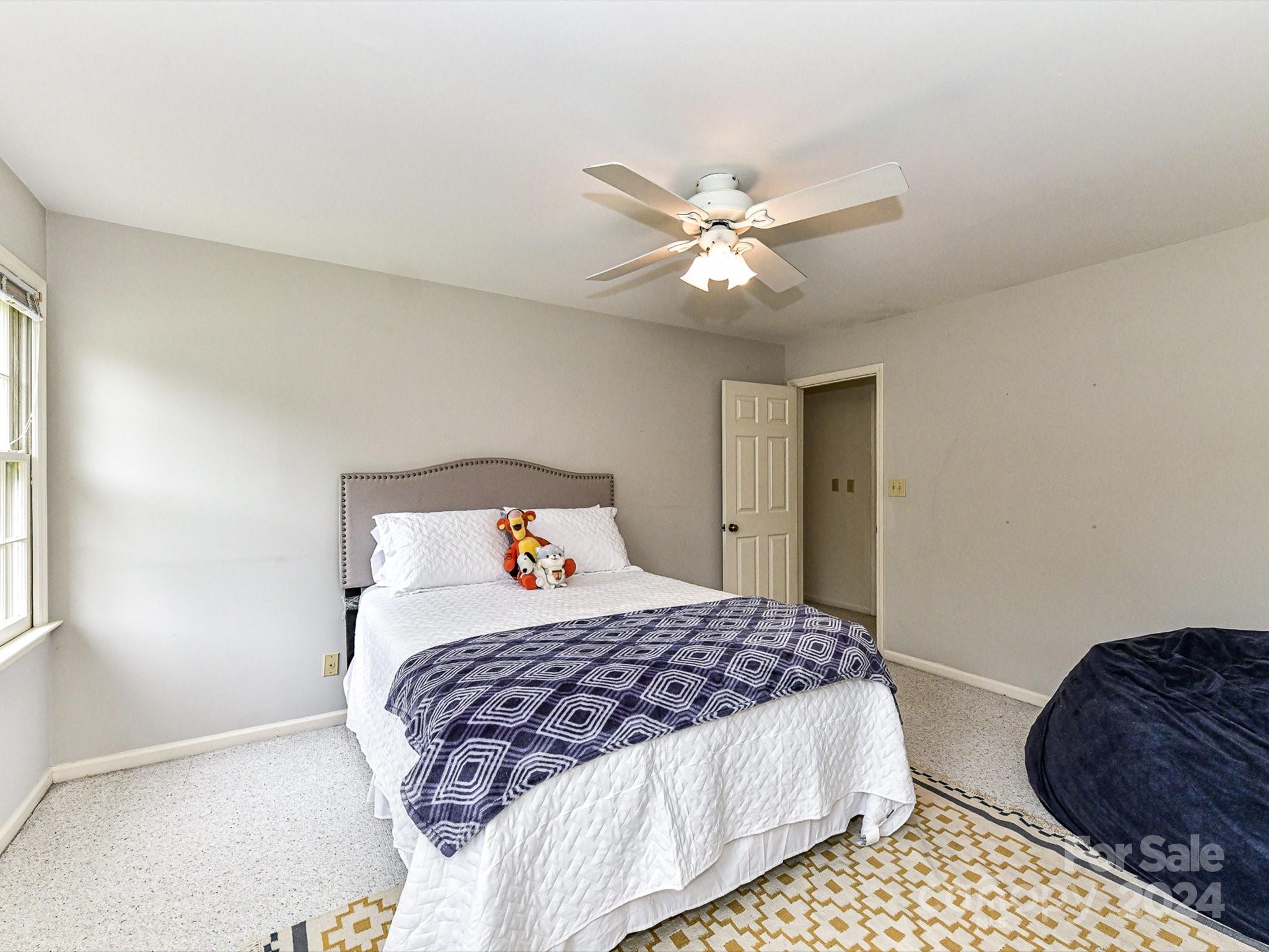 717 Fredricksburg Road Matthews, NC 28105 - Photo 25 of 34 a bedroom with a bed and a dresser