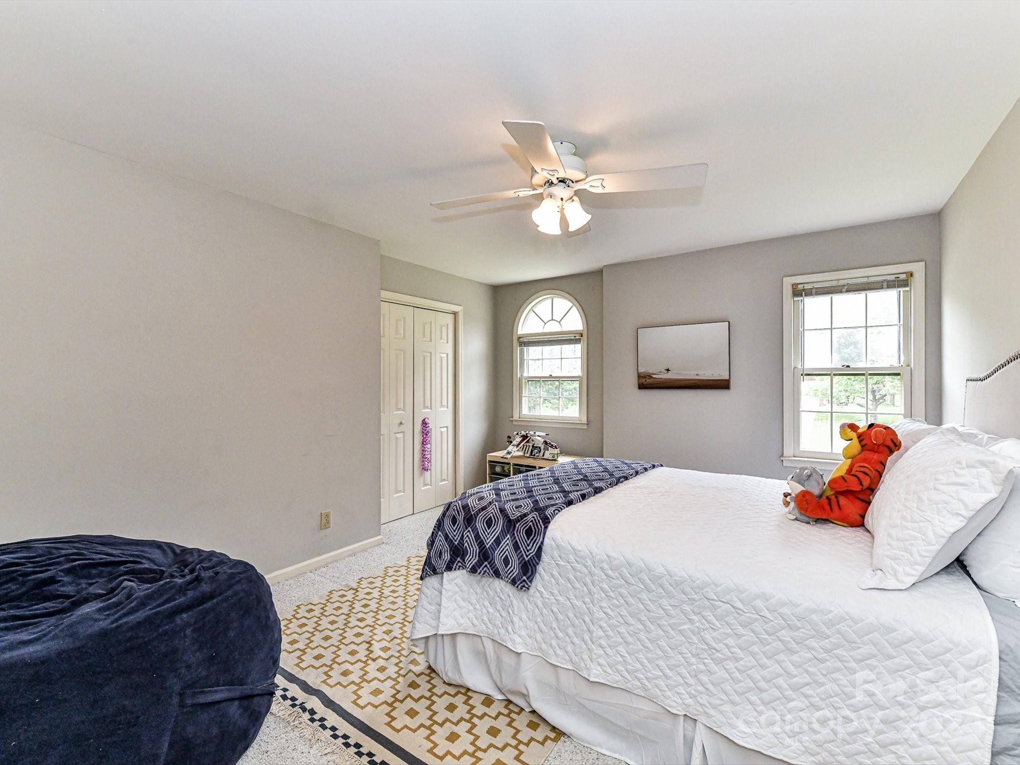 717 Fredricksburg Road Matthews, NC 28105 - Photo 26 of 34 a bedroom with a large bed and a window