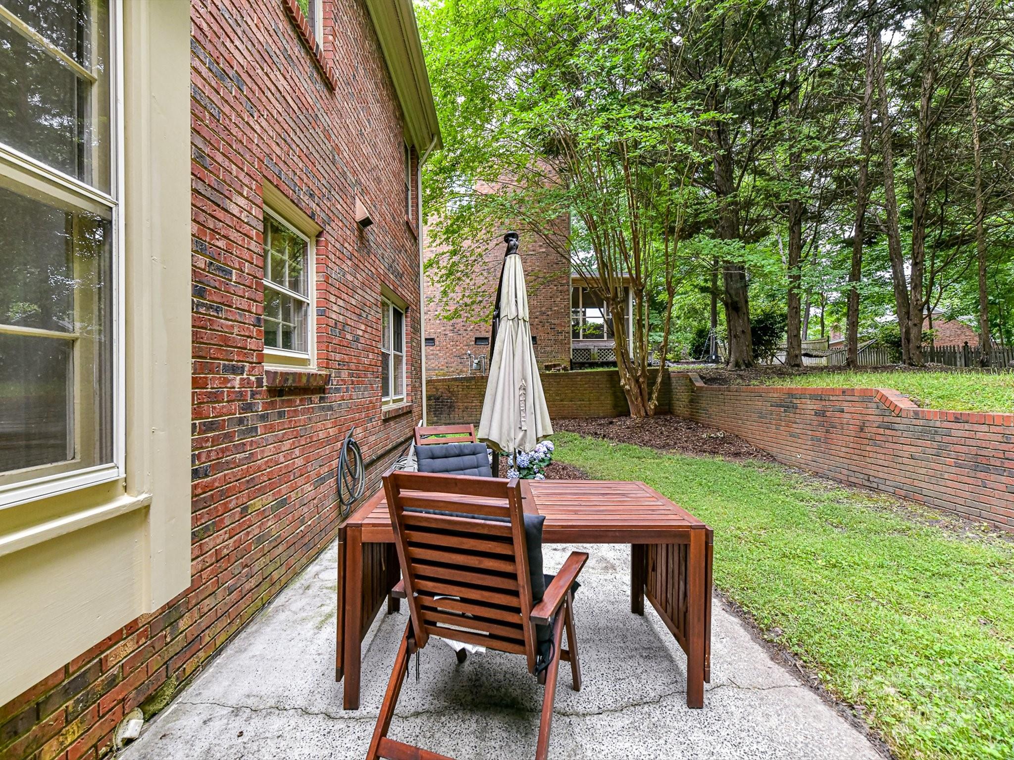 717 Fredricksburg Road Matthews, NC 28105 - Photo 30 of 34 a front view of a house with garden and patio