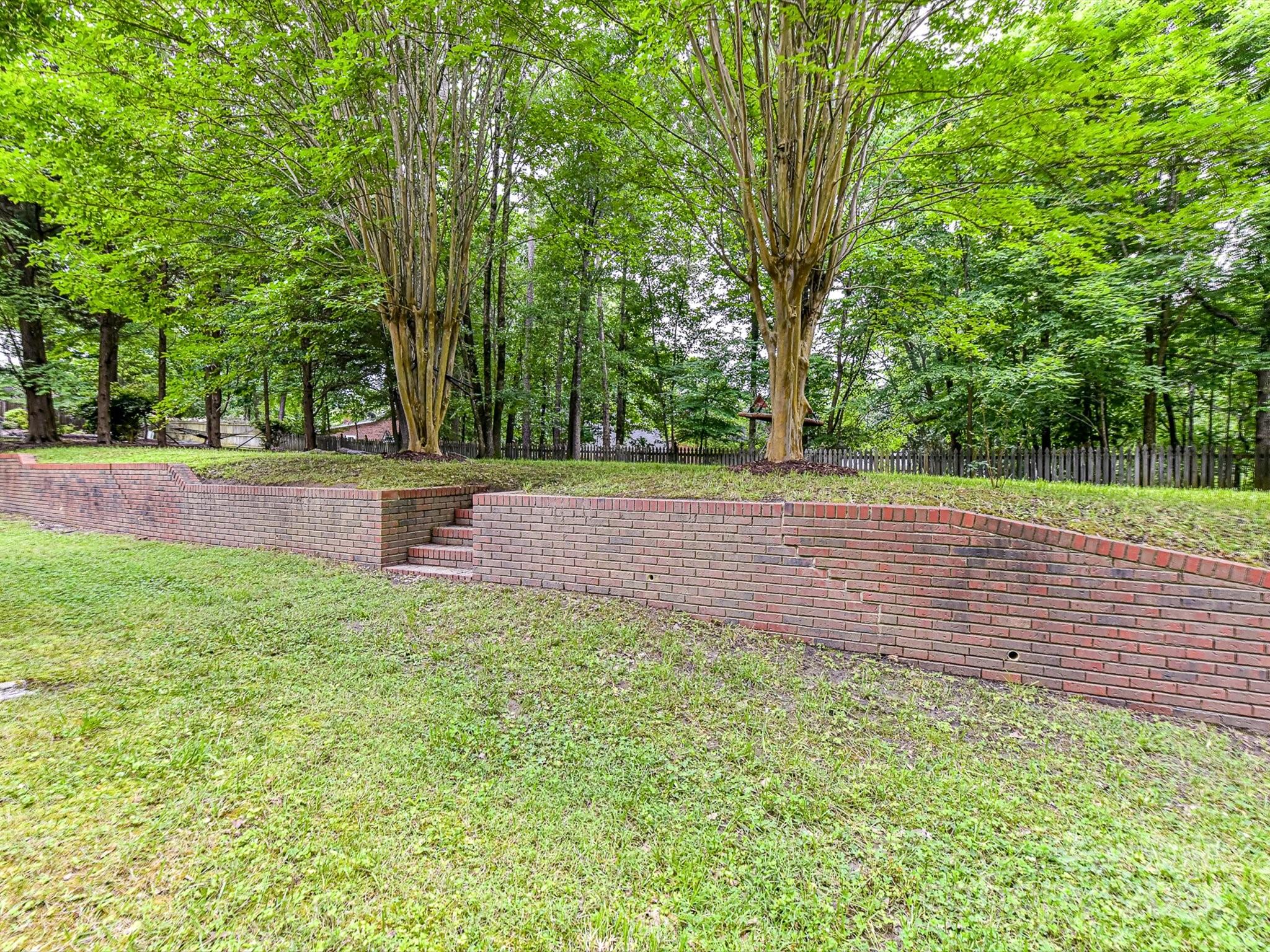 717 Fredricksburg Road Matthews, NC 28105 - Photo 33 of 34 a backyard of a house with lots of green space