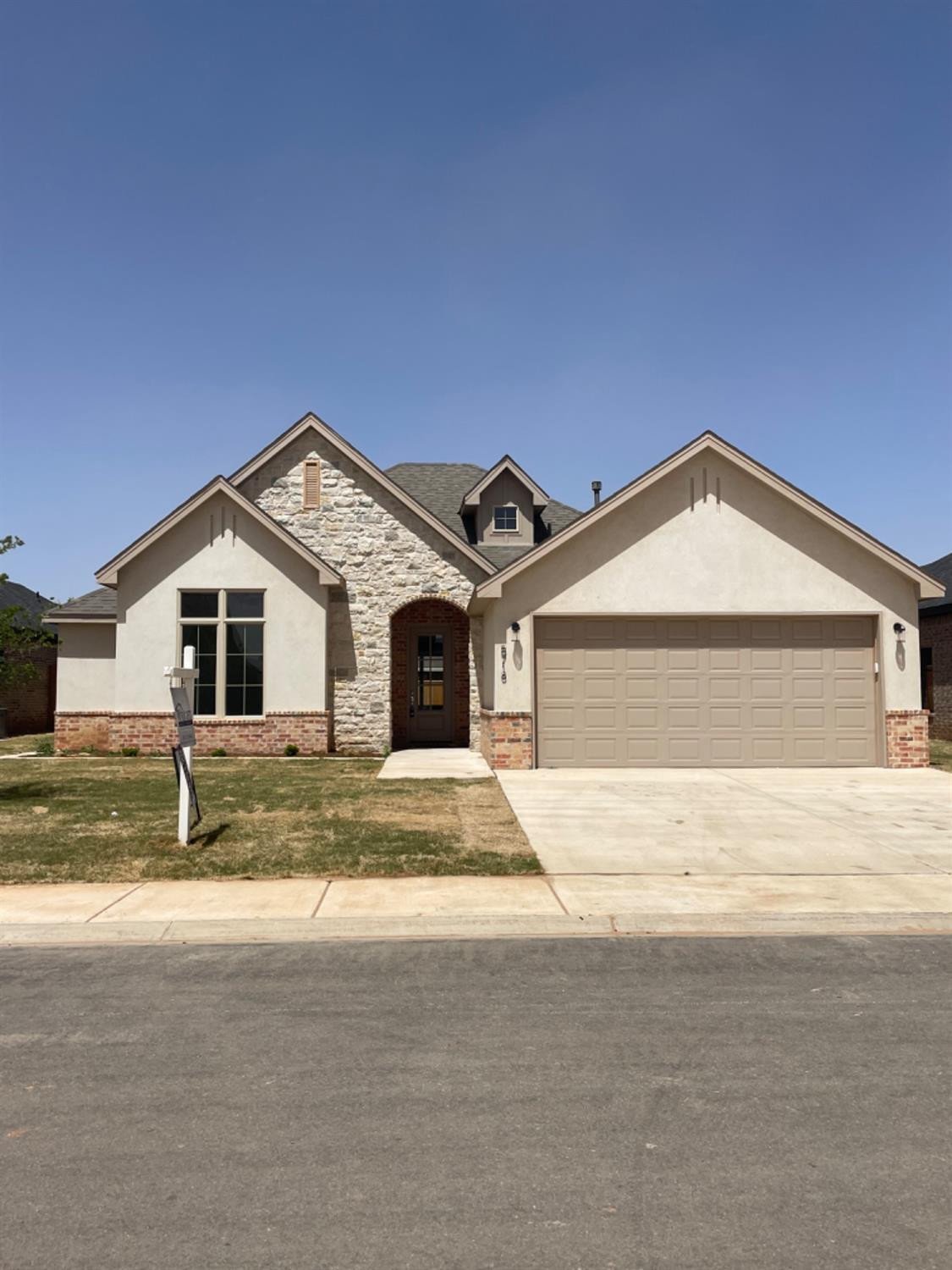 a view of garage and yard