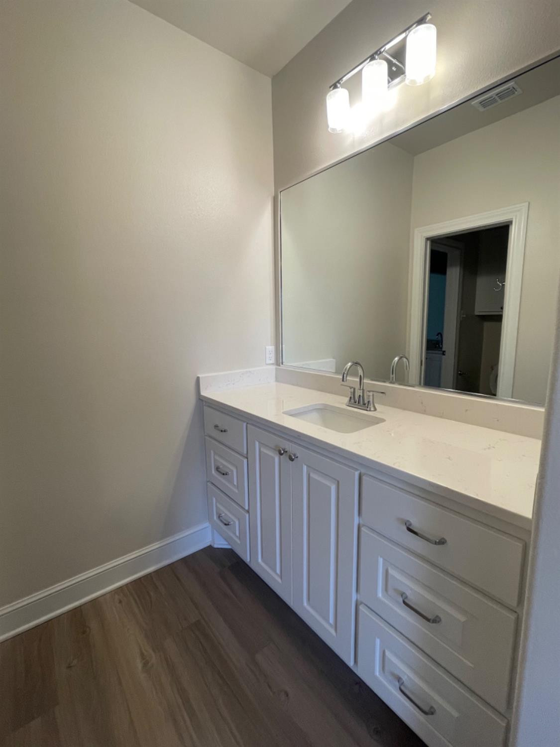 5718 119th Lubbock, TX 79424 - Photo 12 of 17 a bathroom with a sink and a mirror