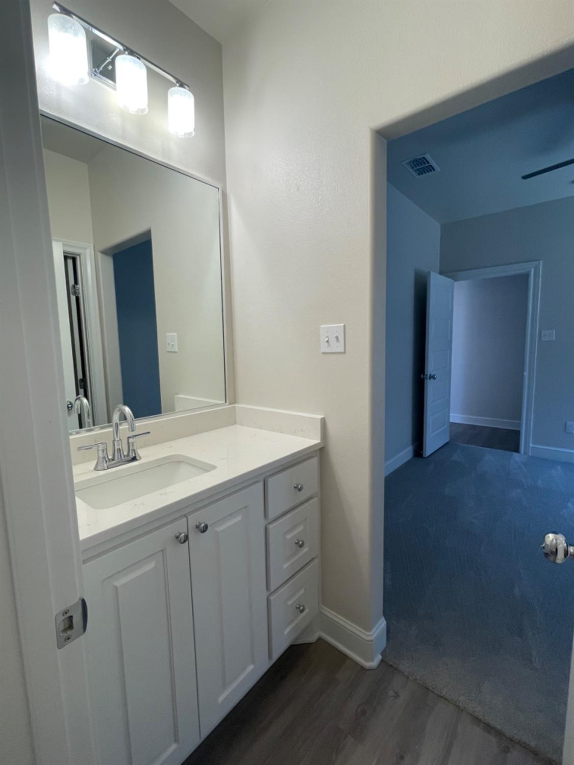 5718 119th Lubbock, TX 79424 - Photo 13 of 17 a bathroom with a double vanity sink and mirror