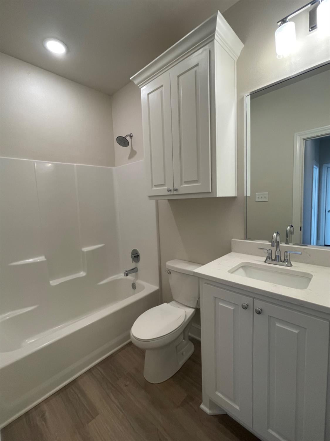 5718 119th Lubbock, TX 79424 - Photo 16 of 17 a bathroom with a toilet a sink and bathtub