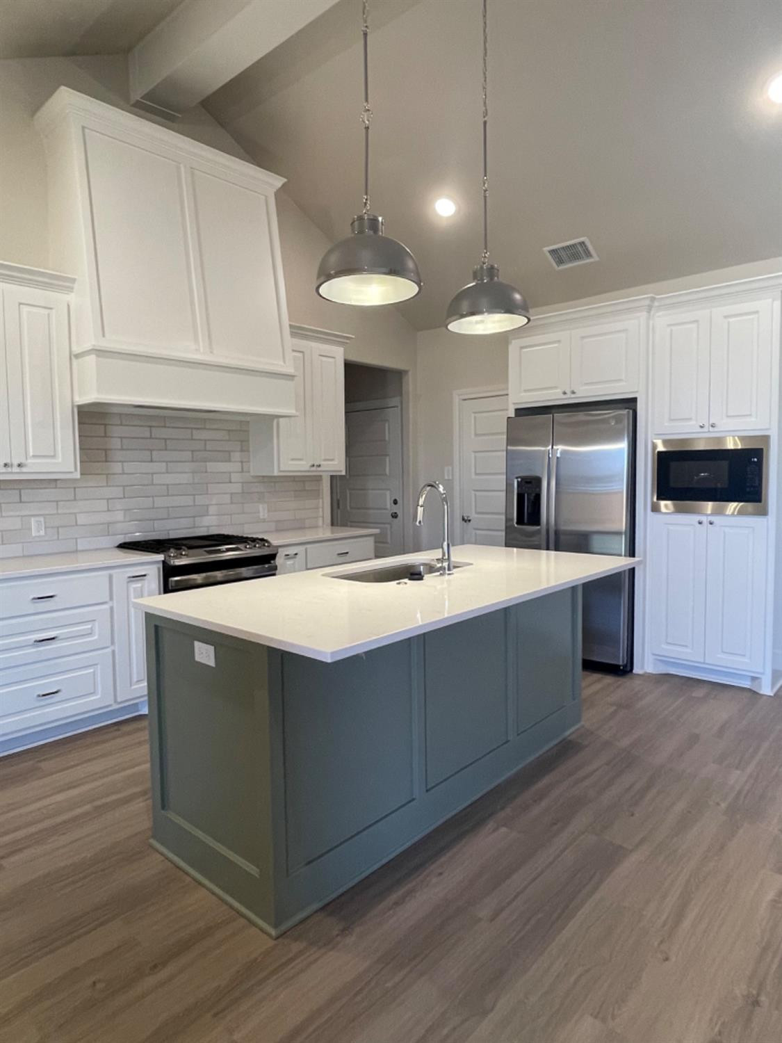5718 119th Lubbock, TX 79424 - Photo 2 of 17 a large kitchen with stainless steel appliances