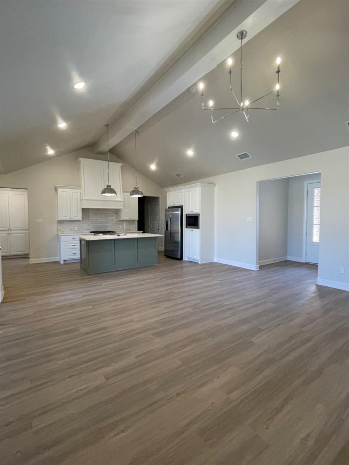 5718 119th Lubbock, TX 79424 - Photo 6 of 17 a view of kitchen with kitchen island microwave and wooden floor