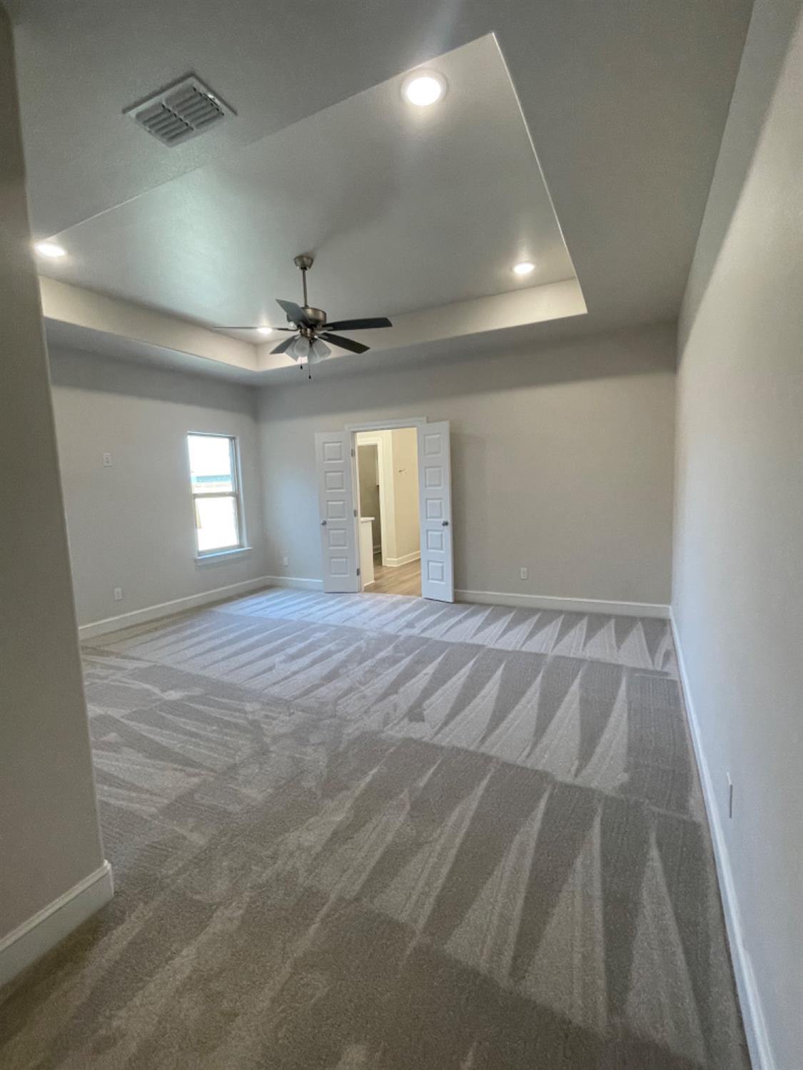 5718 119th Lubbock, TX 79424 - Photo 7 of 17 a view of empty room with window and ceiling fan