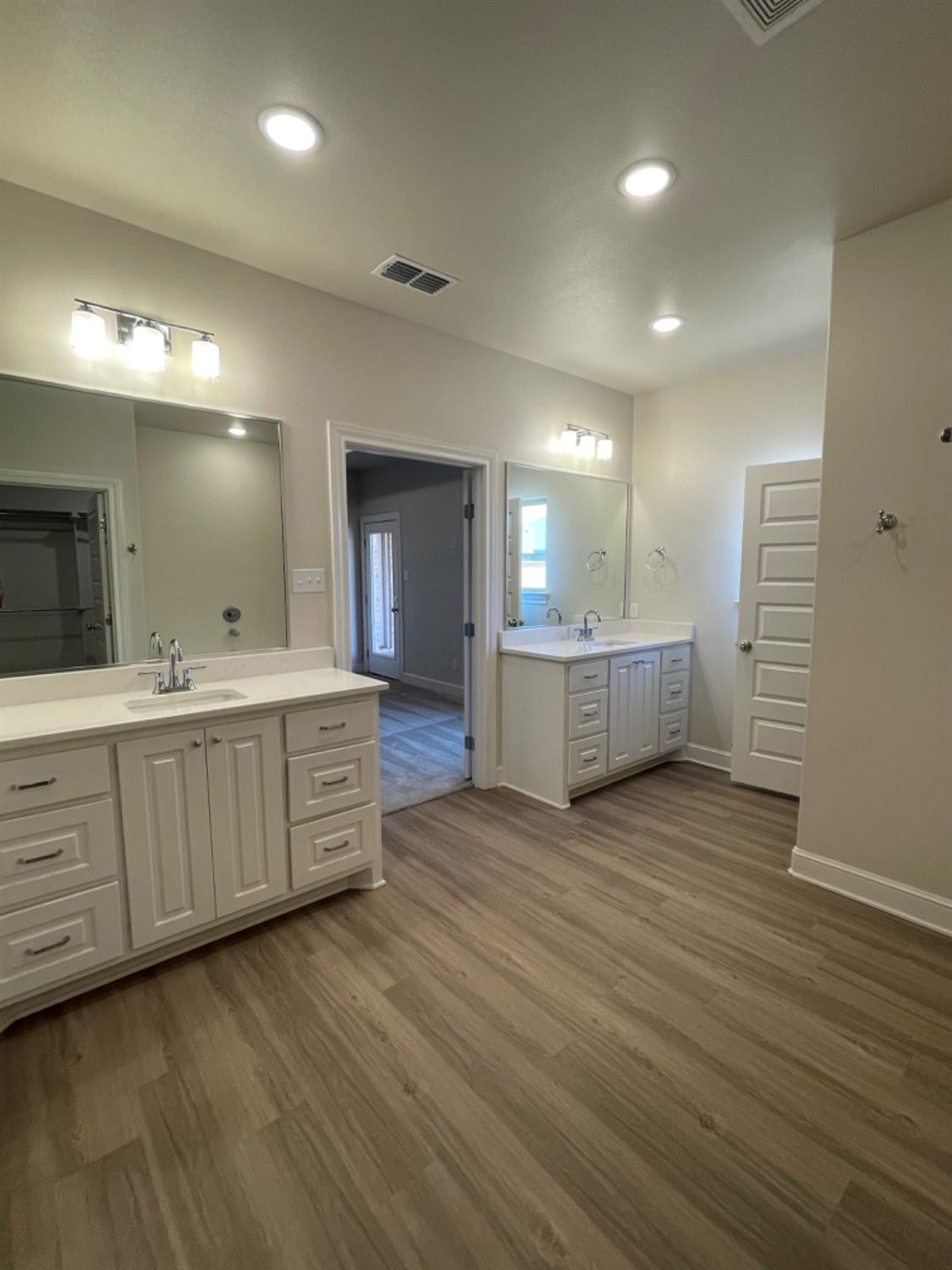 5718 119th Lubbock, TX 79424 - Photo 10 of 17 a bathroom with a double vanity sink and a mirror