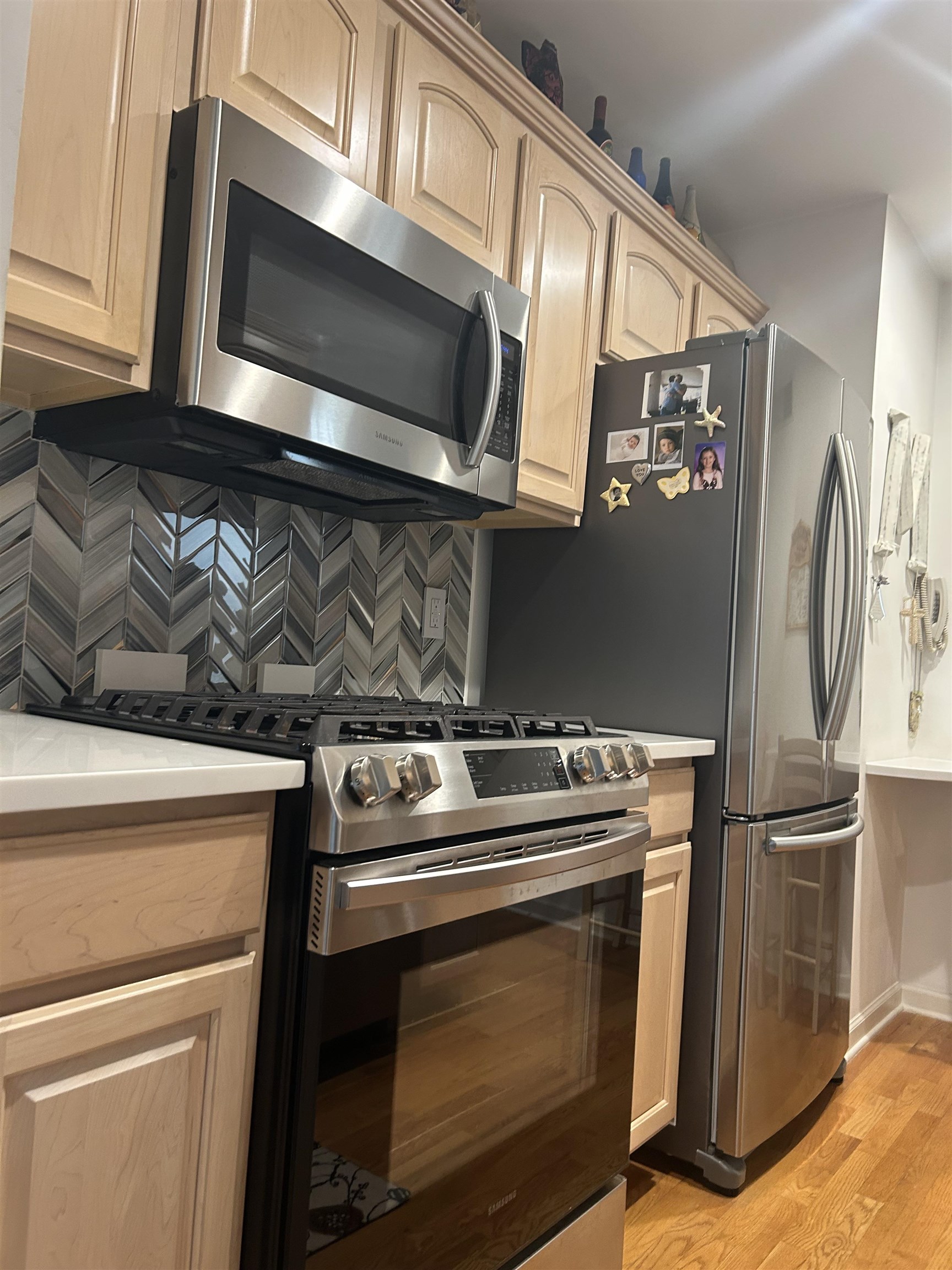 302 Grand Ridge Drive, Unit 302 Ridgefield, NJ 07657 - Photo 28 of 47 a kitchen with a stove microwave and refrigerator