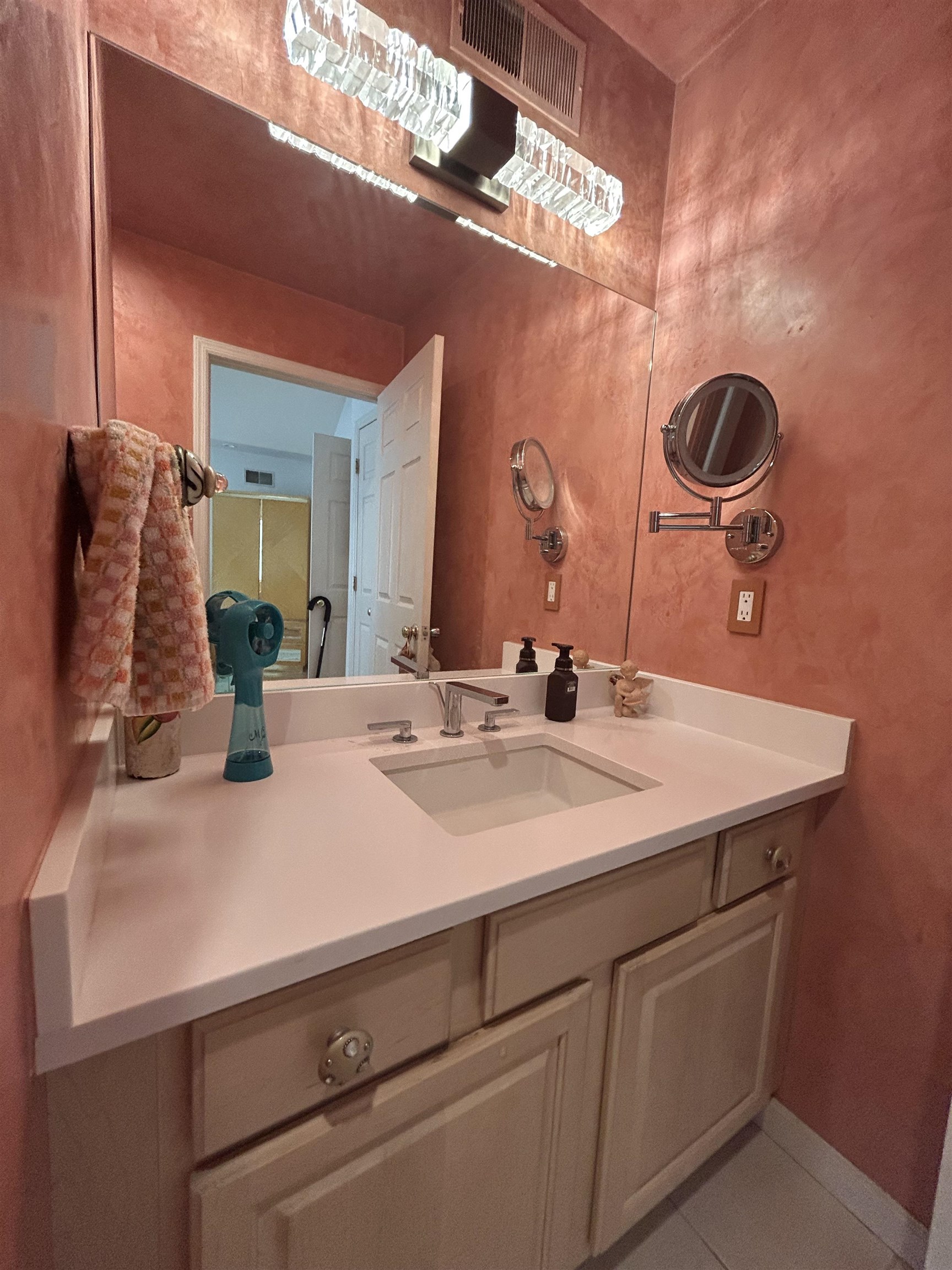 302 Grand Ridge Drive, Unit 302 Ridgefield, NJ 07657 - Photo 3 of 47 a bathroom with a sink and a mirror
