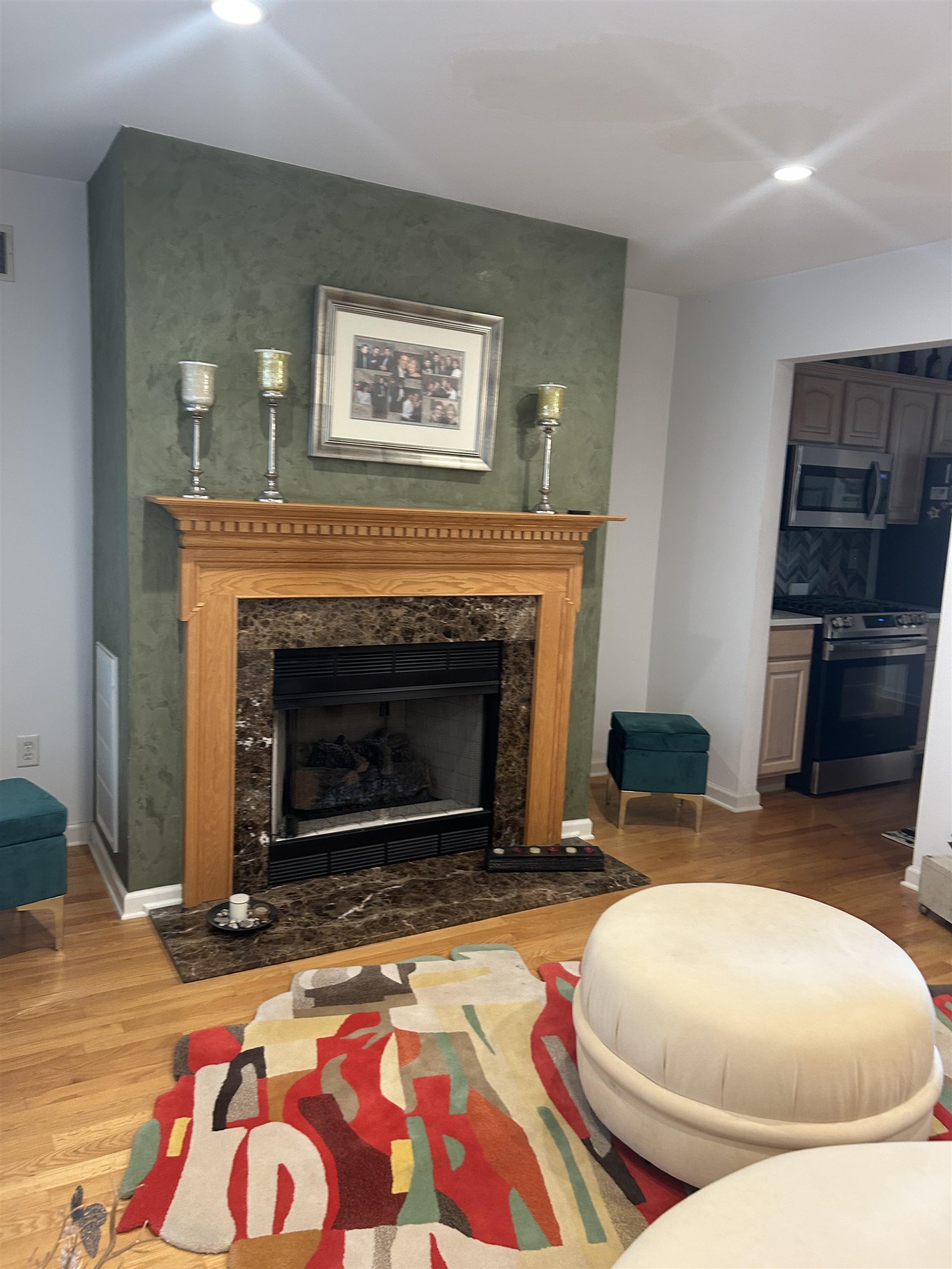 302 Grand Ridge Drive, Unit 302 Ridgefield, NJ 07657 - Photo 31 of 47 a living room with furniture and a fireplace