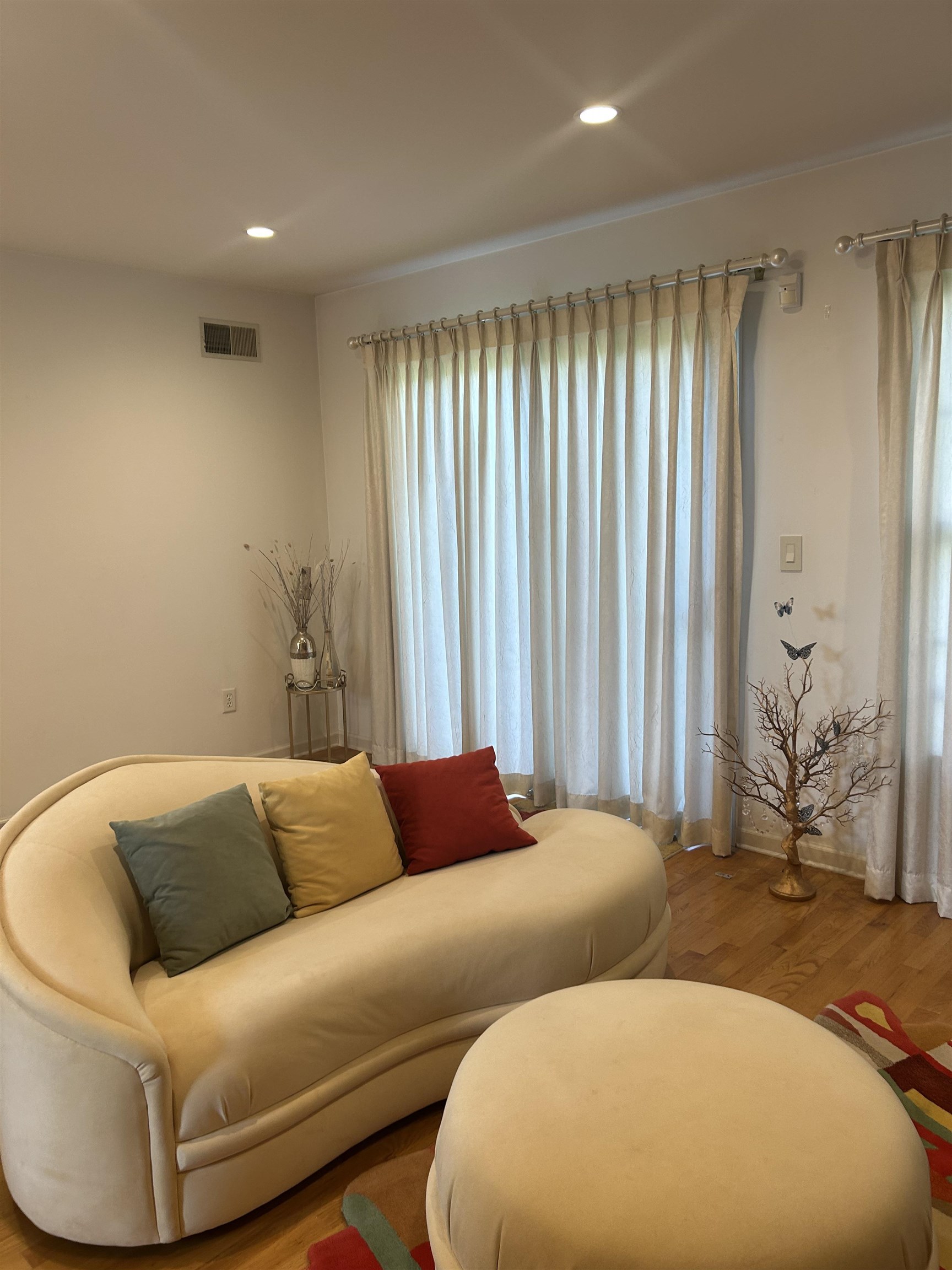 302 Grand Ridge Drive, Unit 302 Ridgefield, NJ 07657 - Photo 32 of 47 a blue couch sitting in a room next to a window