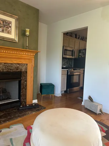 a bedroom with a bed and a fireplace