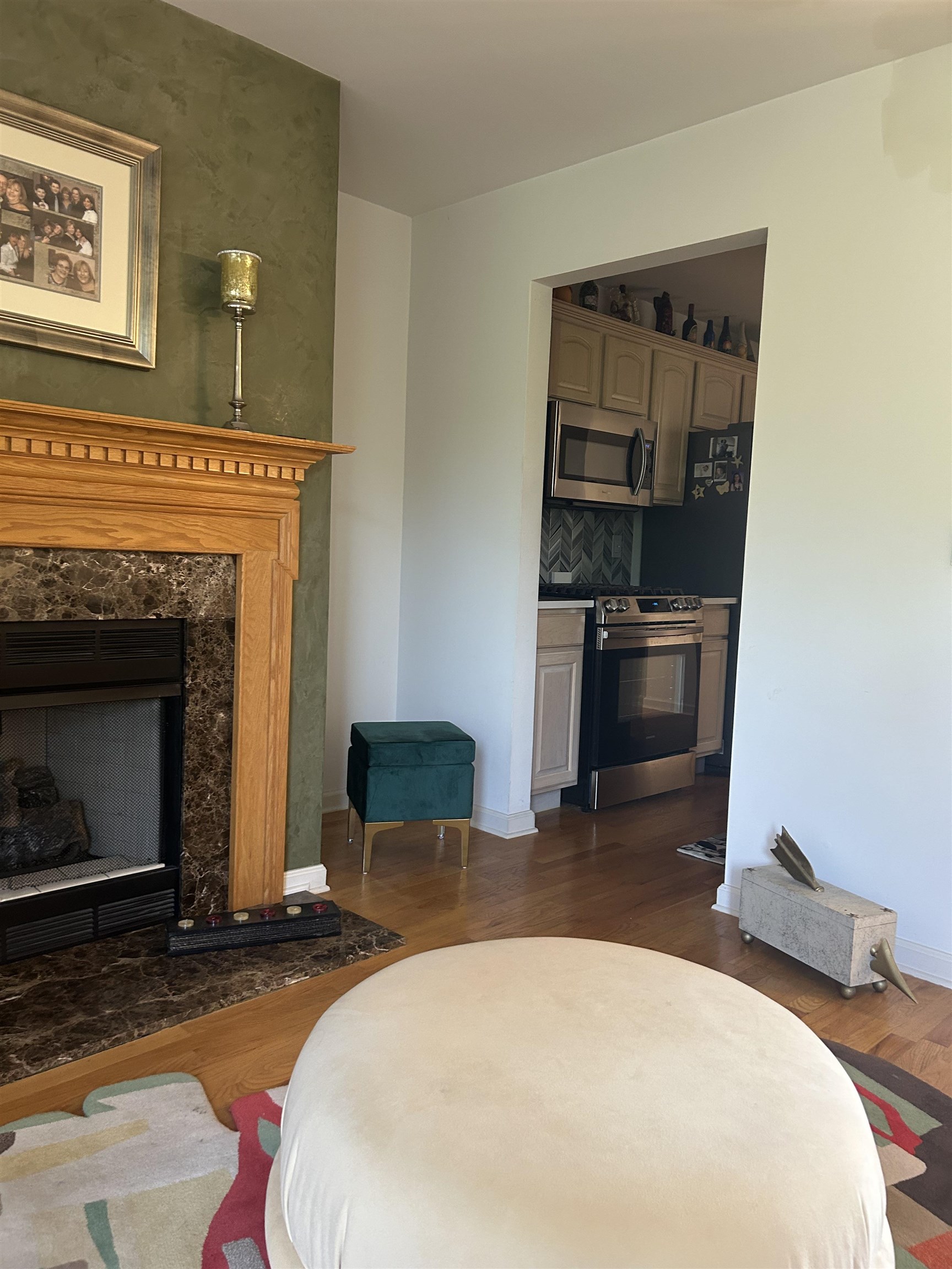 302 Grand Ridge Drive, Unit 302 Ridgefield, NJ 07657 - Photo 34 of 47 a bedroom with a bed and a fireplace