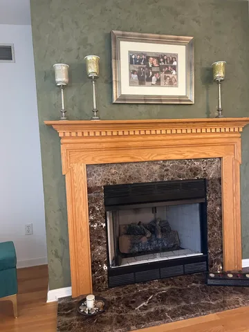 a fireplace with a clock on top of it