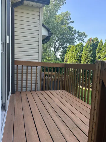 a view of balcony with wooden floor