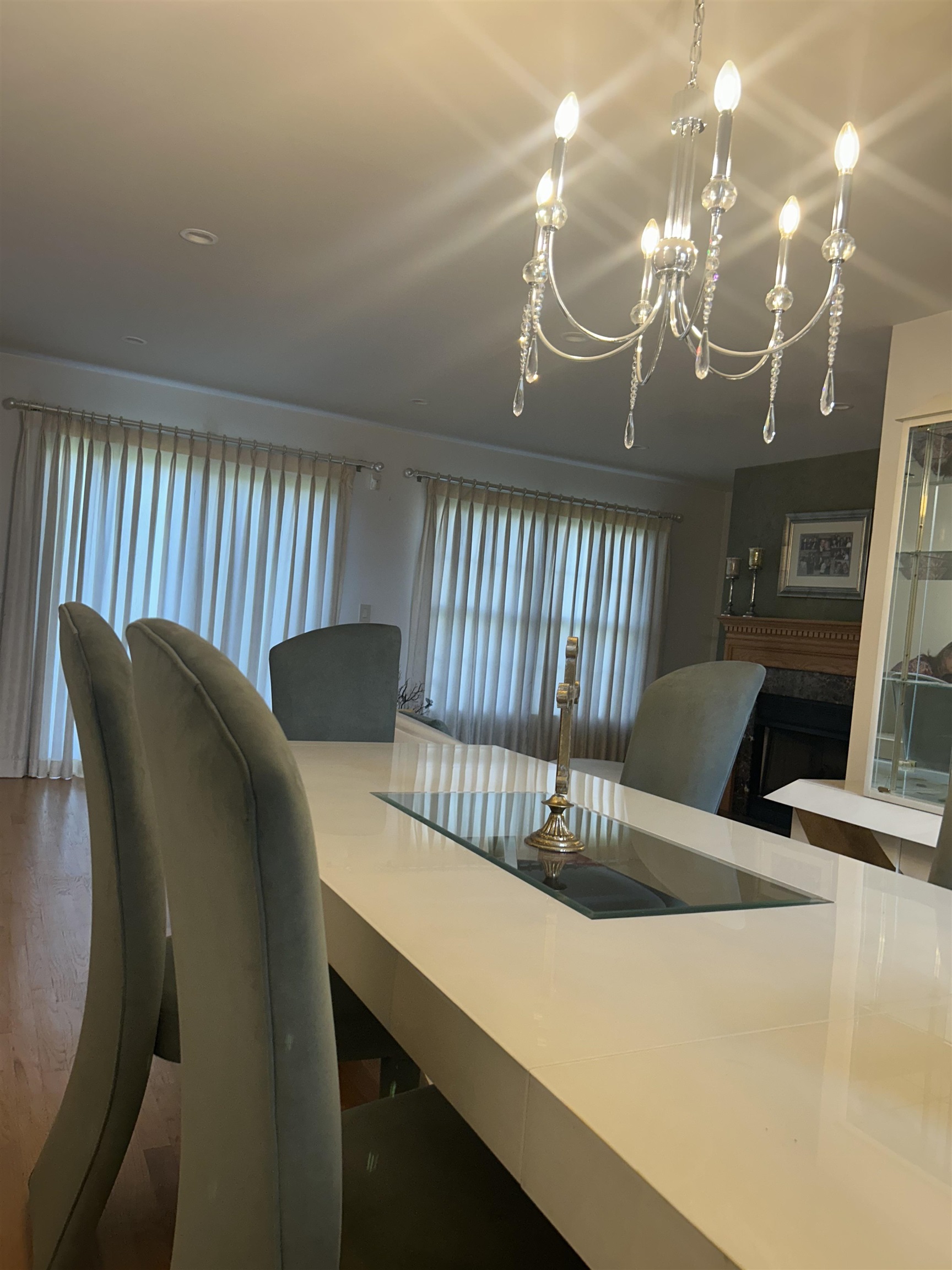 302 Grand Ridge Drive, Unit 302 Ridgefield, NJ 07657 - Photo 41 of 47 a view of a dining room with furniture and a chandelier