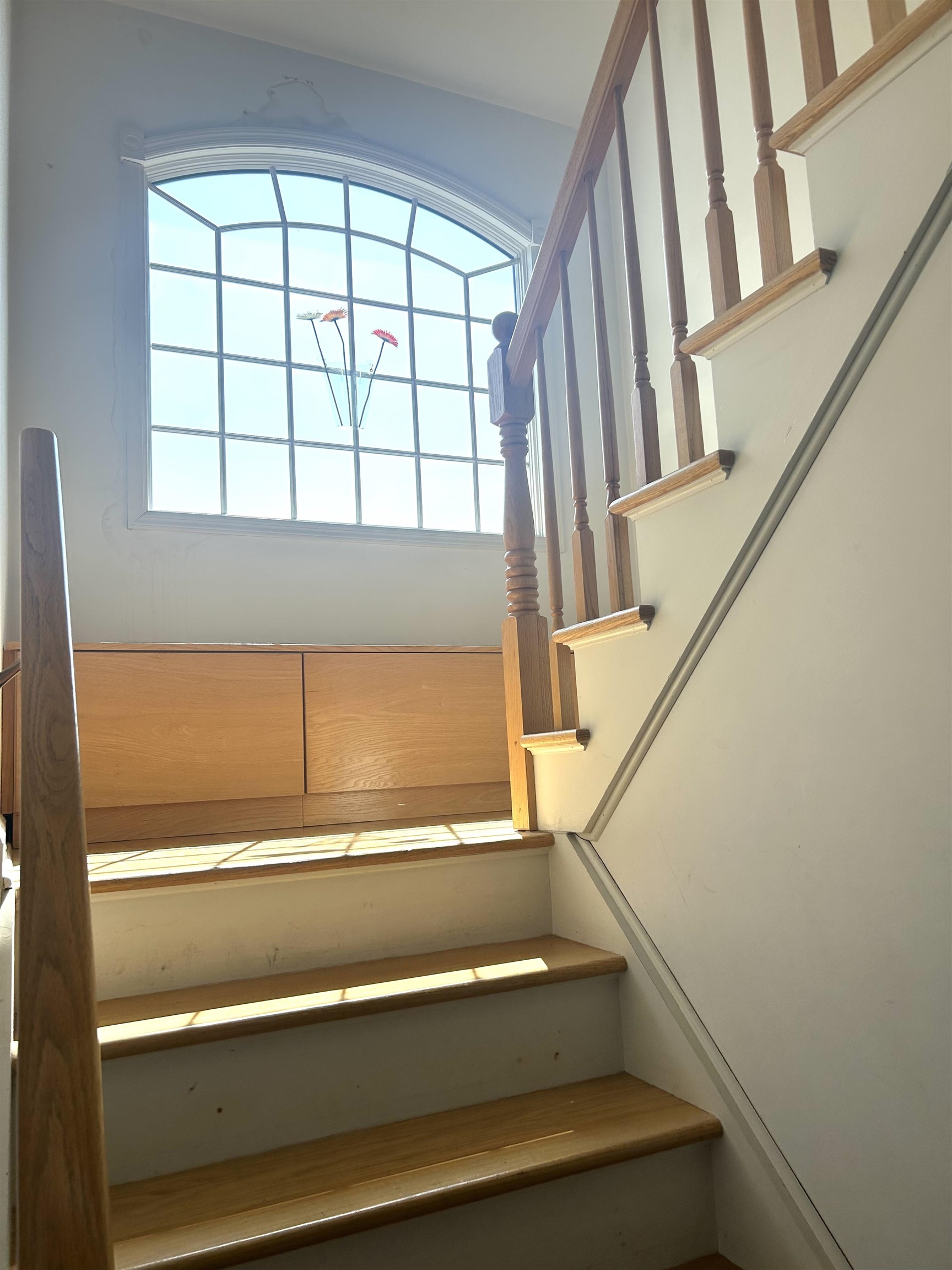 302 Grand Ridge Drive, Unit 302 Ridgefield, NJ 07657 - Photo 43 of 47 a view of staircase with white walls and a window