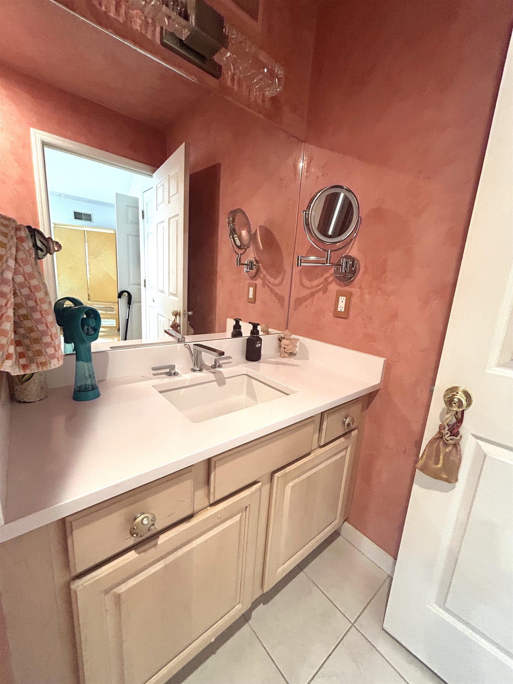 302 Grand Ridge Drive, Unit 302 Ridgefield, NJ 07657 - Photo 6 of 47 a bathroom with a sink and a mirror