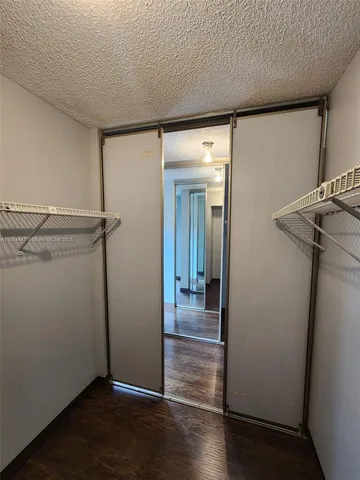 a view of an empty walk in closet