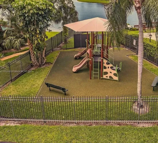 a view of a house with a yard and garage