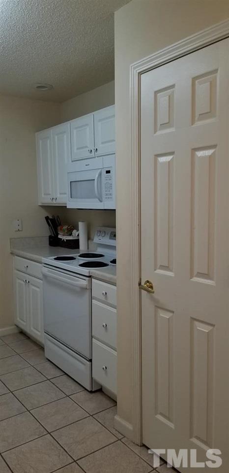 11341 Involute Place, Unit 101 Raleigh, NC 27617 - Photo 14 of 20 A view of the right side of the kitchen from the dining area.