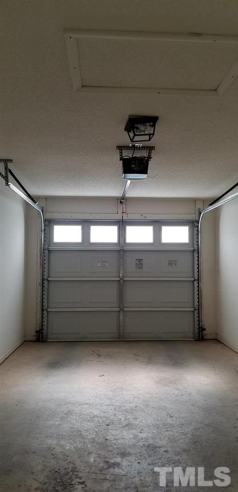11341 Involute Place, Unit 101 Raleigh, NC 27617 - Photo 16 of 20 The 1 car garage enters in to the kitchen.