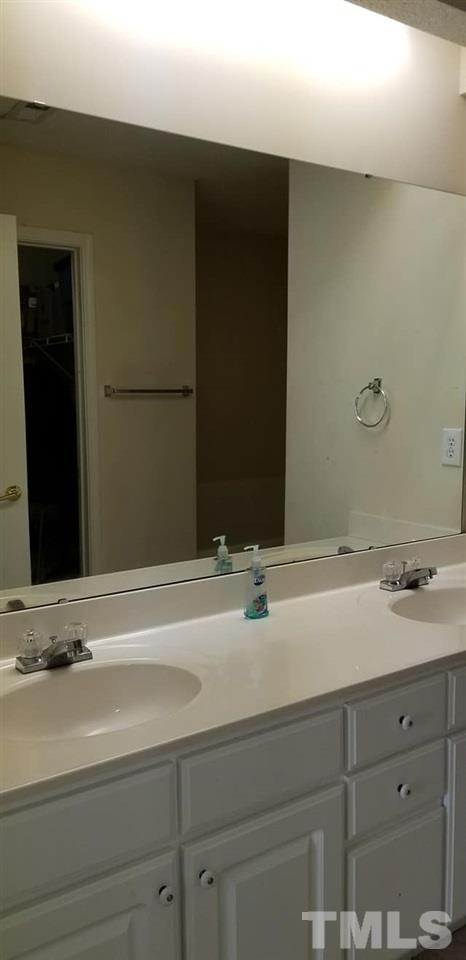 11341 Involute Place, Unit 101 Raleigh, NC 27617 - Photo 5 of 20 The master bathroom has a dual vanity and walk in closet.