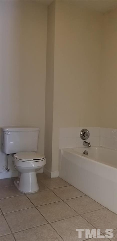 11341 Involute Place, Unit 101 Raleigh, NC 27617 - Photo 7 of 20 The master bathroom also includes a tub for soaking.