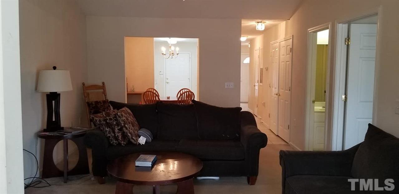 11341 Involute Place, Unit 101 Raleigh, NC 27617 - Photo 8 of 20 Spacious living room with vaulted ceilings.