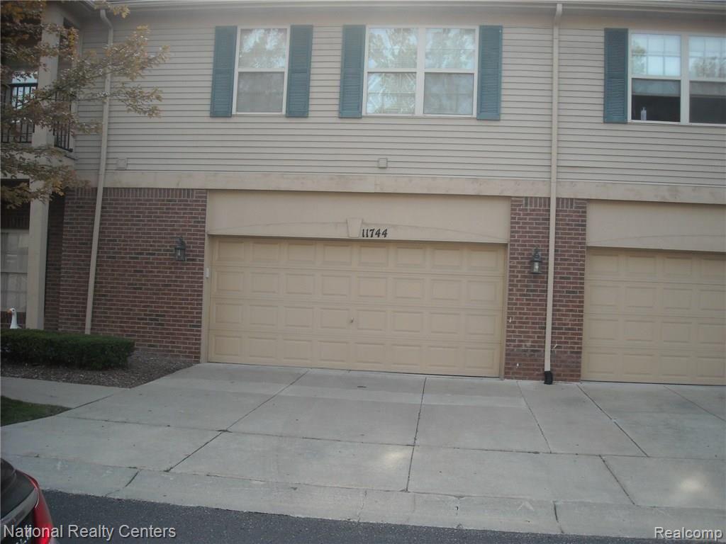 11744 Farmington Road Livonia, MI 48150 - Photo 2 of 11 REAR VIEW 2 CAR GARAGE