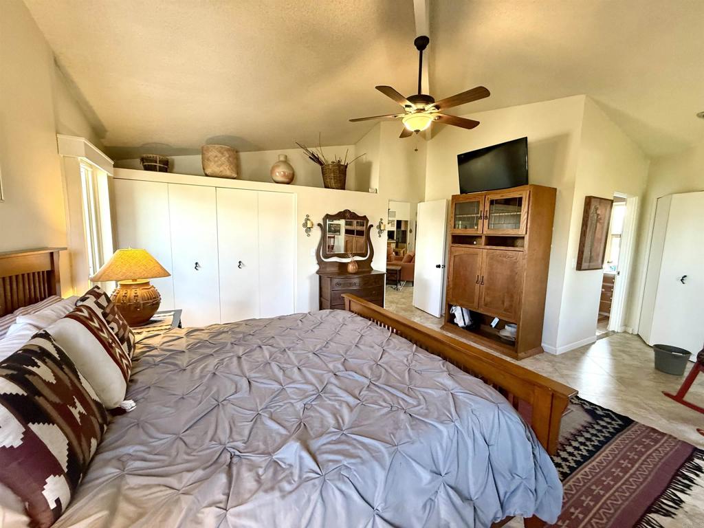 37800 Da Vall Drive, Unit 10 Rancho Mirage, CA 92270 - Photo 11 of 31 a bed room with a bed and a television